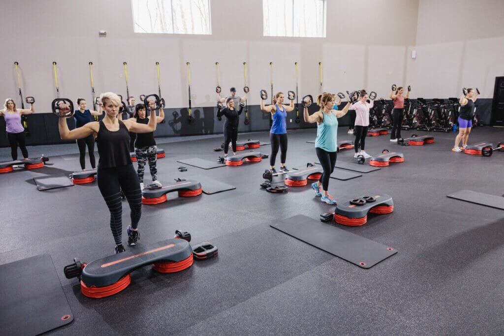 Group fitness class with step platforms